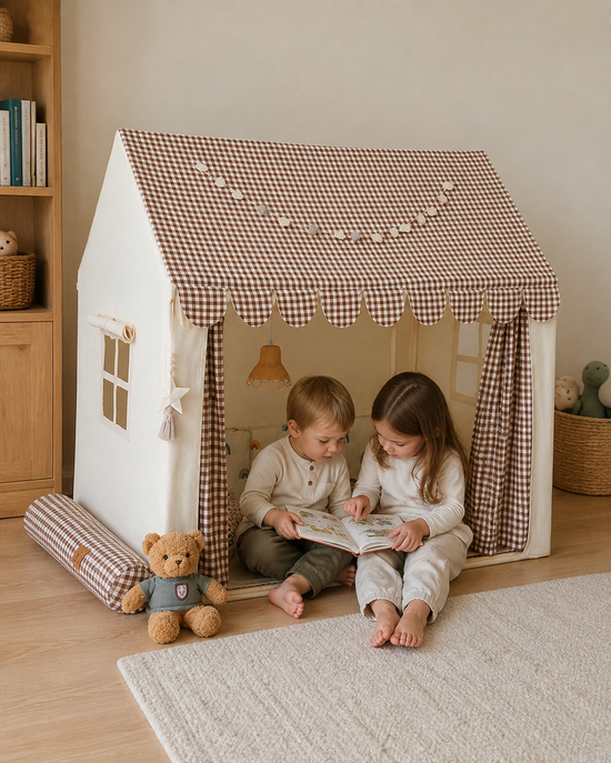 Styled visualization of siblings playing in the Gingham Cottage Playhouse at home