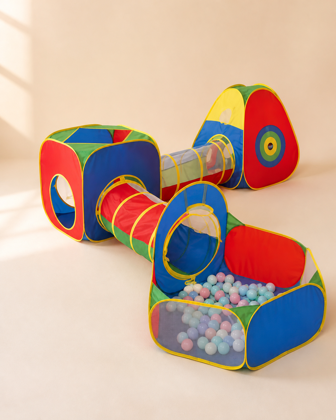 Colorful pop-up kids play tunnel set with connecting cubes on a warm studio background