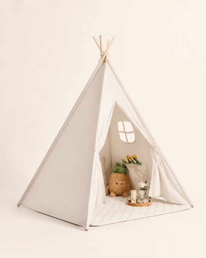 Cream padded kids teepee tent with a peek-through window on a warm studio background