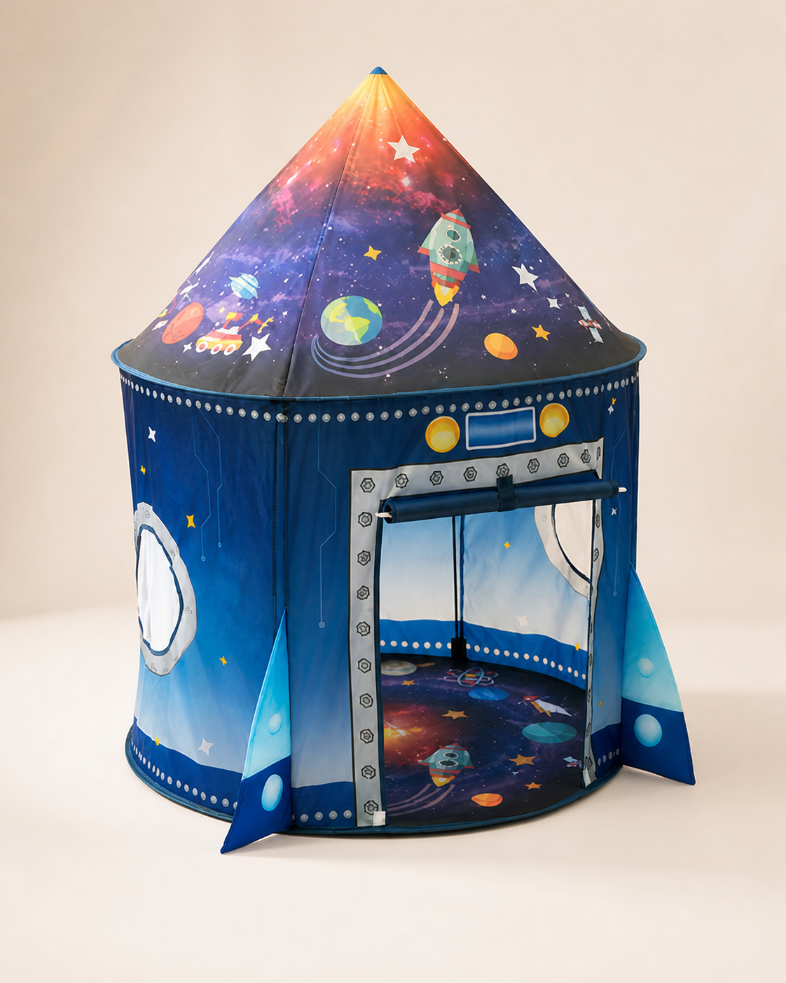Blue rocket-shaped kids play tent with galaxy print on a warm studio background