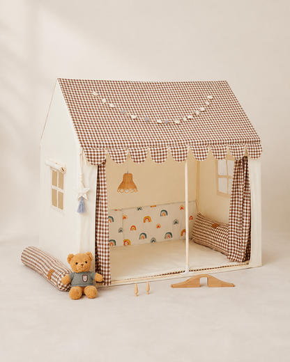 Cream kids playhouse tent with brown gingham roof and awning on a warm studio background