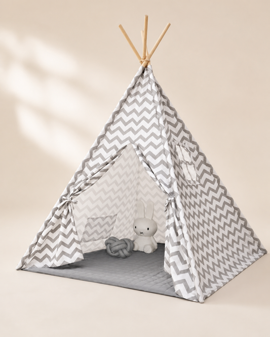 Gray and white chevron kids teepee tent on a warm studio background