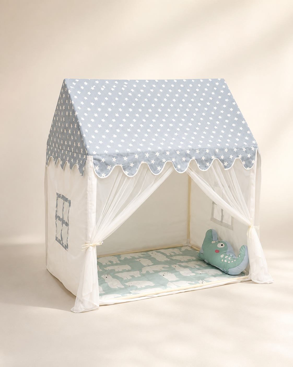 Kids cottage play tent with gray polka-dot roof on a warm studio background