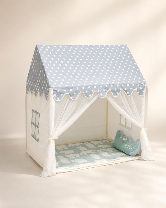 Kids cottage play tent with gray polka-dot roof on a warm studio background