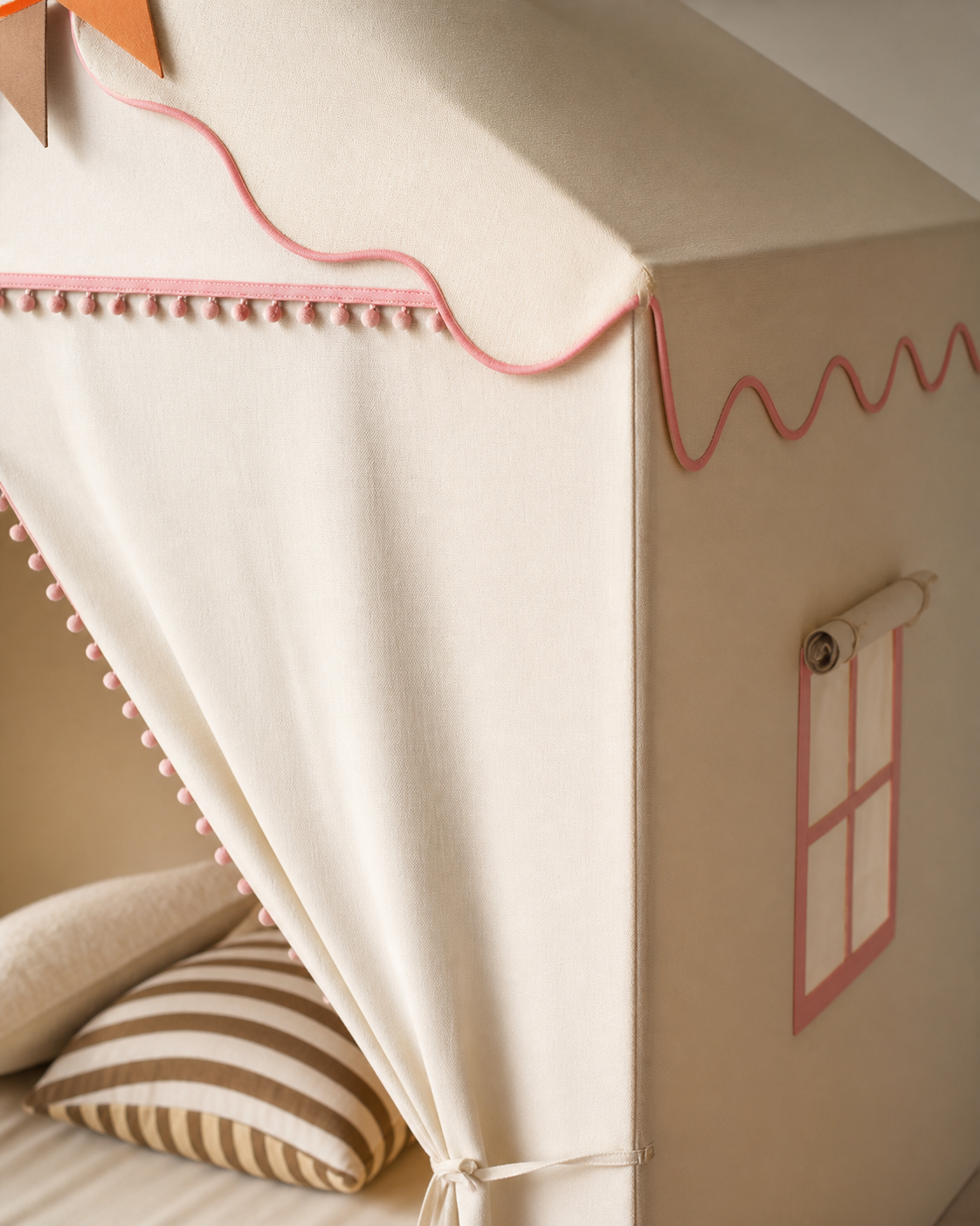 Close-up of the scalloped trim and window detail on the Storytime Cottage Playhouse