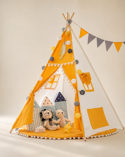 Mustard yellow foldable kids teepee tent with bunting on a warm studio background