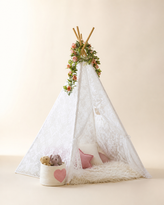White lace kids teepee tent on a warm studio background